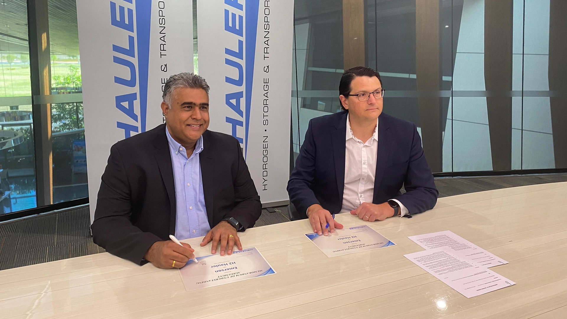 Emerson’s Mike Train and H2 Hauler’s Tyson Cooney sign collaboration agreement.