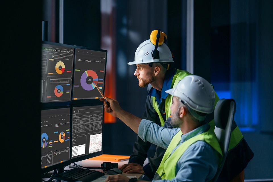 Group of operators control process on product line uses industry 4.0 and digital technology on modern factory. Two engineers follow assembly process uses SCADA system which AI technology and UI 