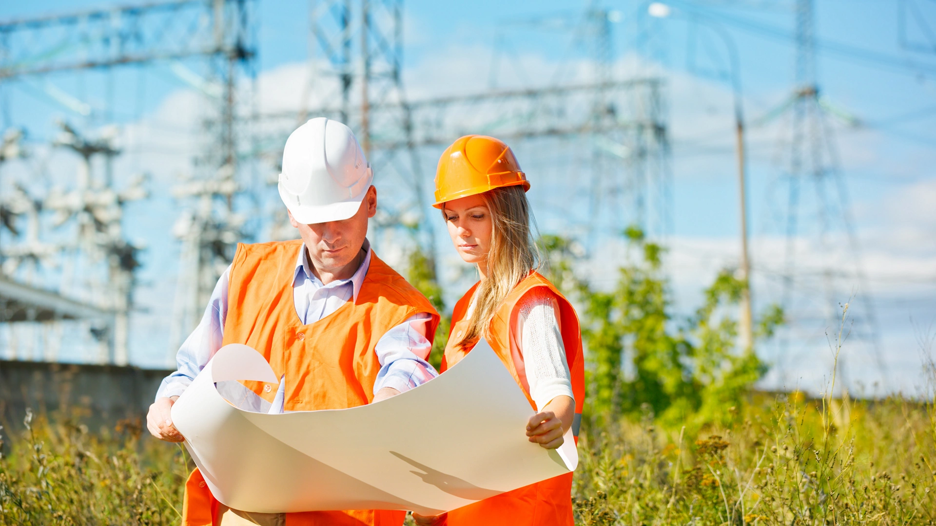 woman and man working as architects on a construction site