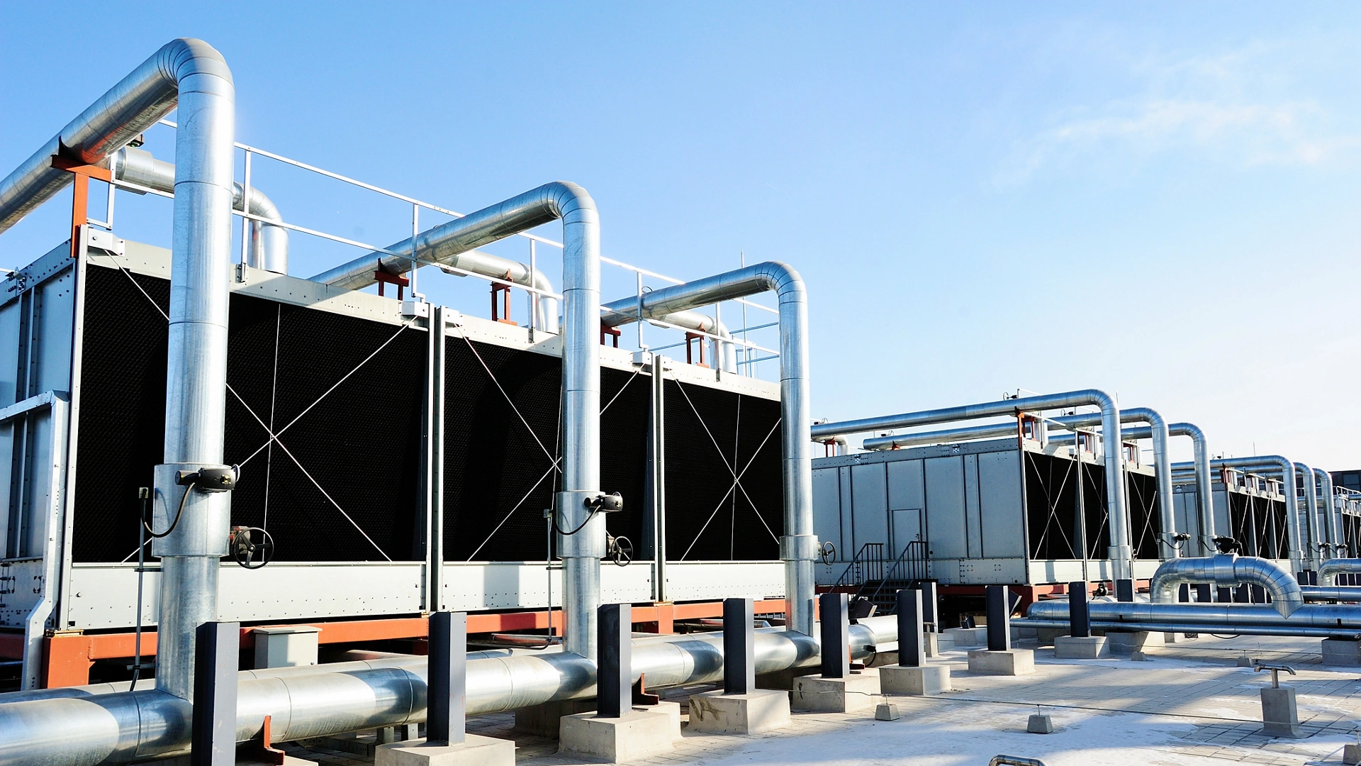 Sets of cooling towers in data center building.