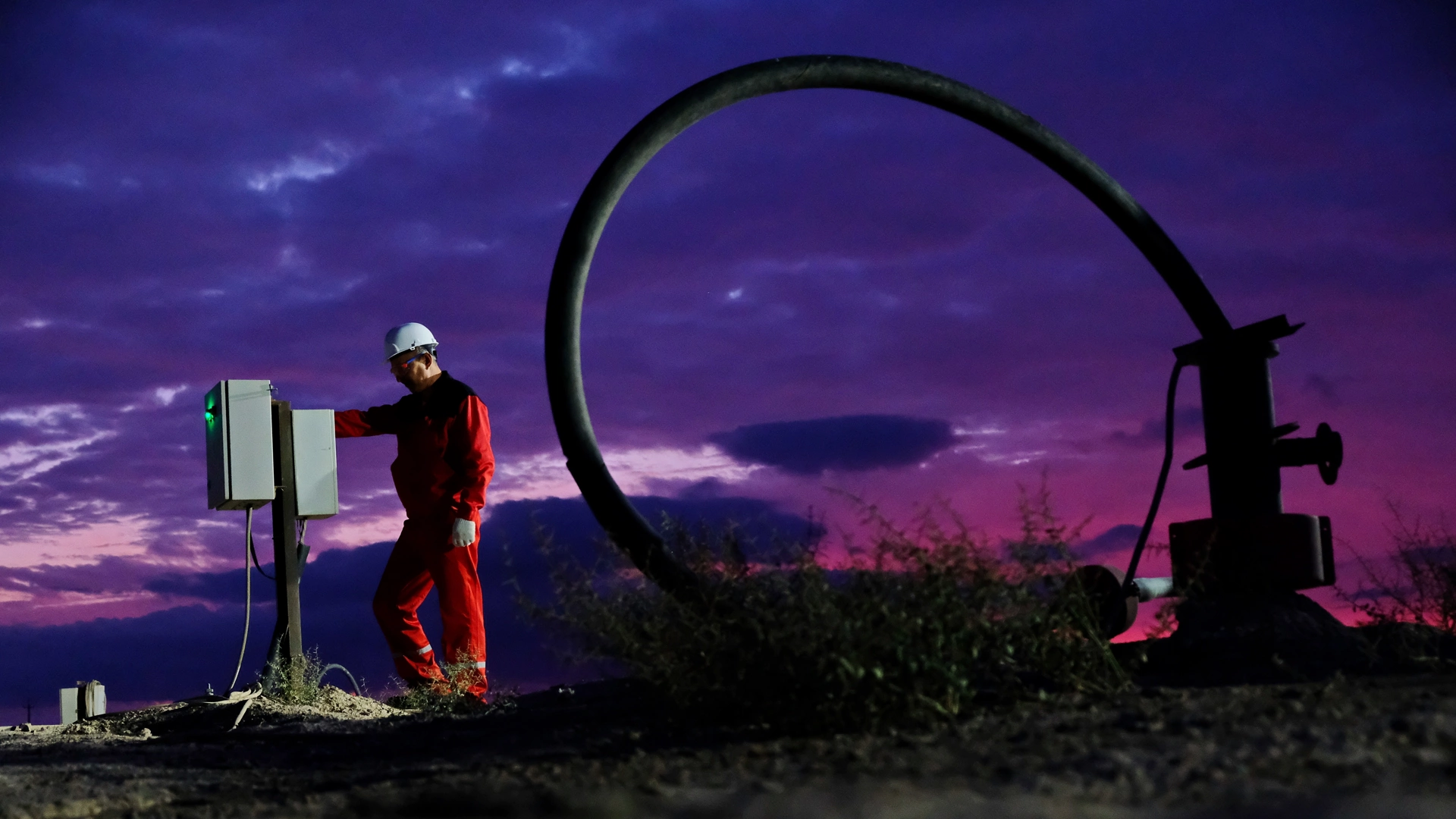 Kyzylorda region, Kazakhstan - 09.14.2019 : A worker monitors the indicators next to the uranium mining plant at the mine at night.