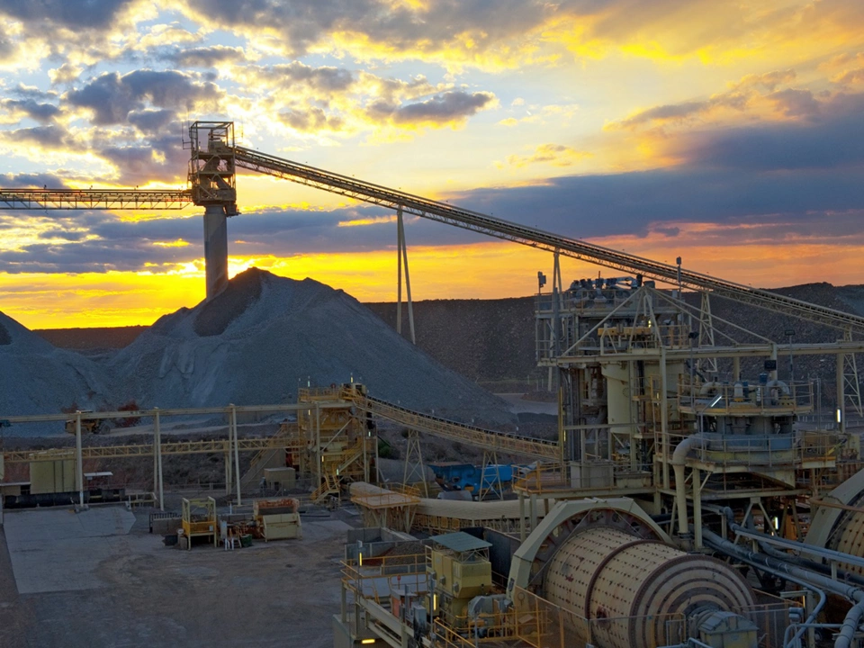 Sunset over mine, red sunset reflecting over the metals of the mine infrastructure Australia.