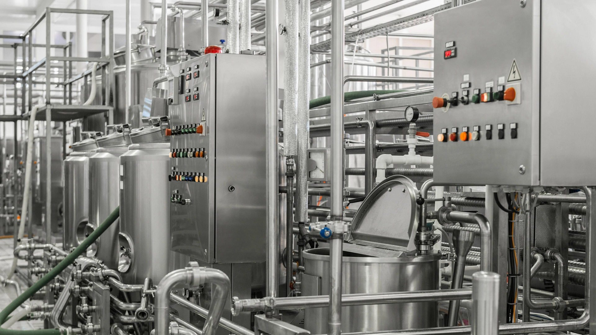 electronic control panel and tank at a milk factory. equipment at the dairy plant