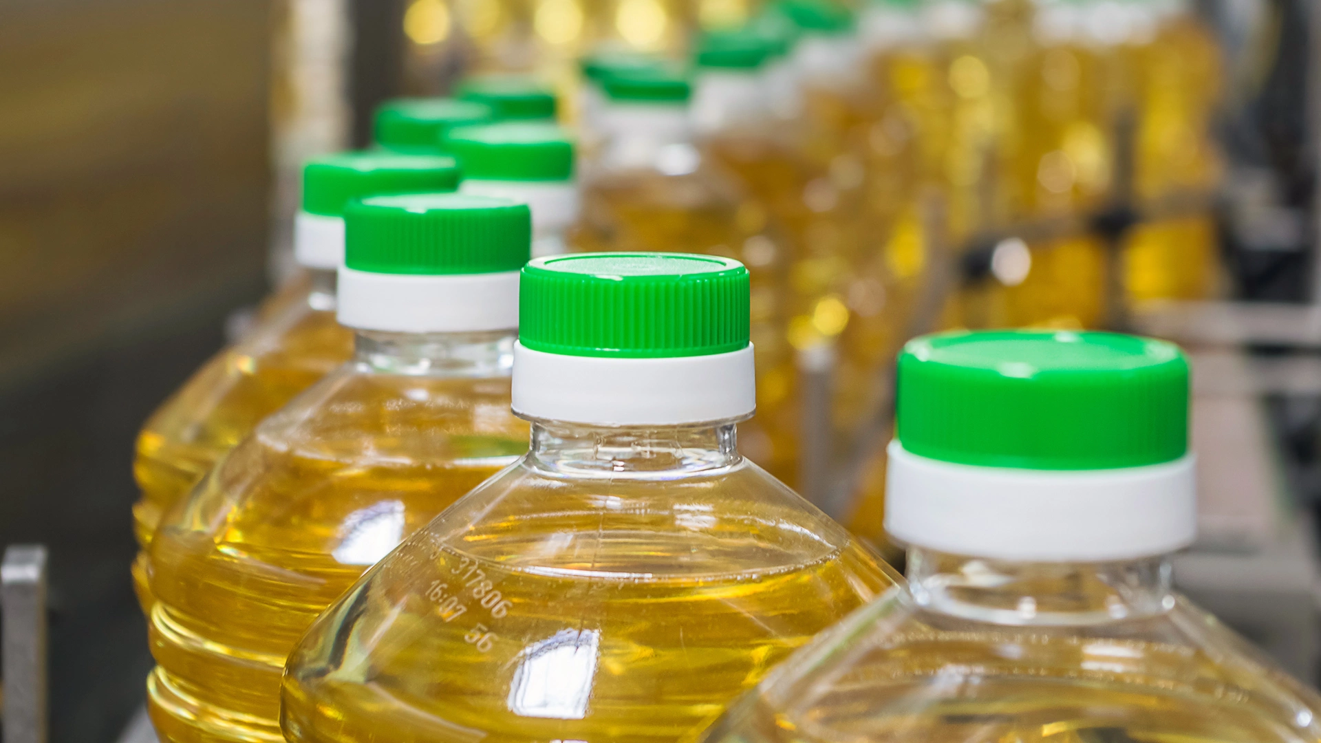 Bottle with sunflower oil on the conveyor