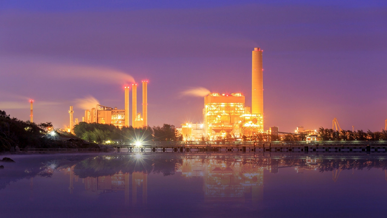 Oil refinery at twilight, behind the sea, Map Ta Phut, Rayong, Thailand