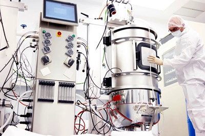 Scientist working with a bioreactor for cell culture