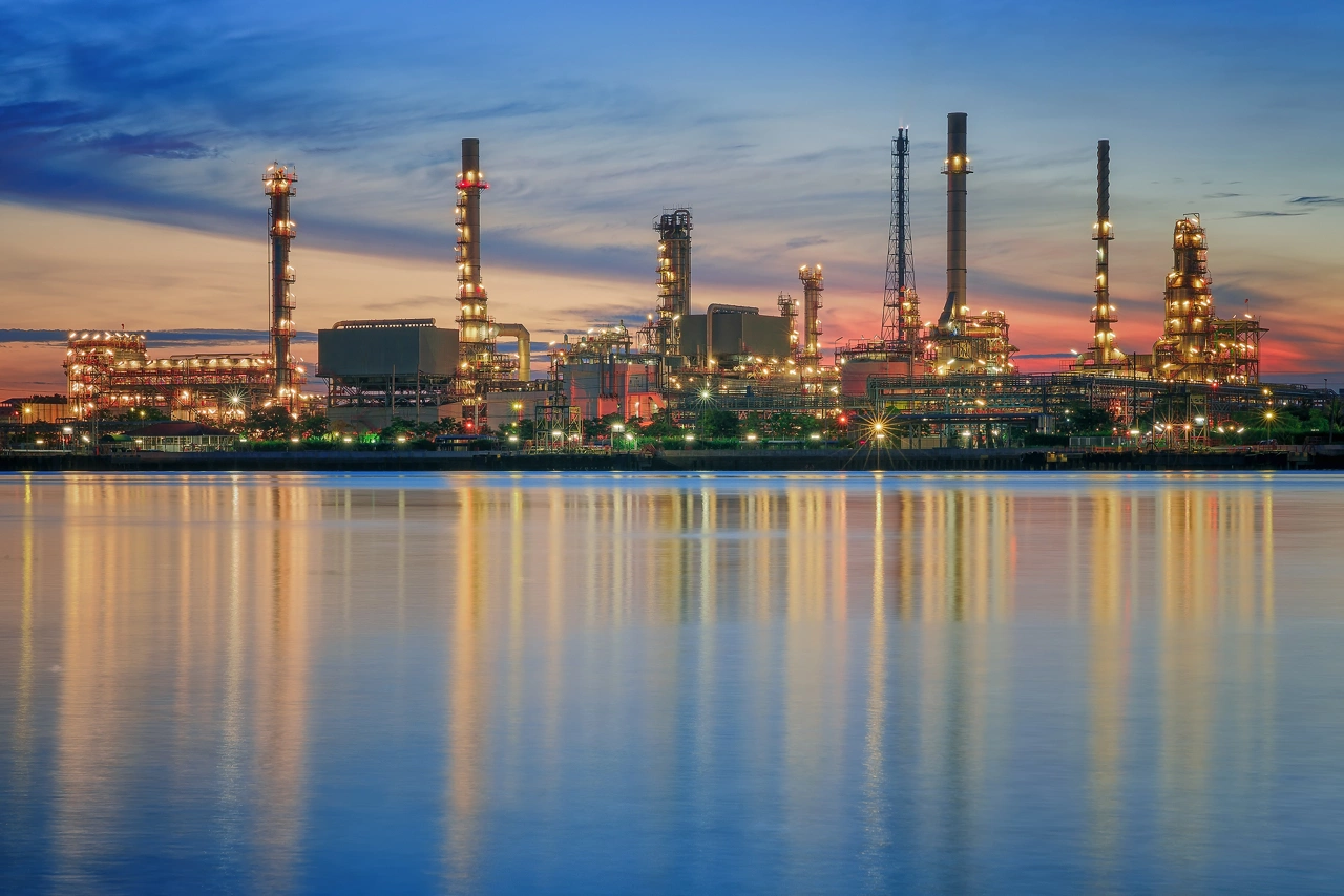 petrochemical plant in night time with reflection over the river