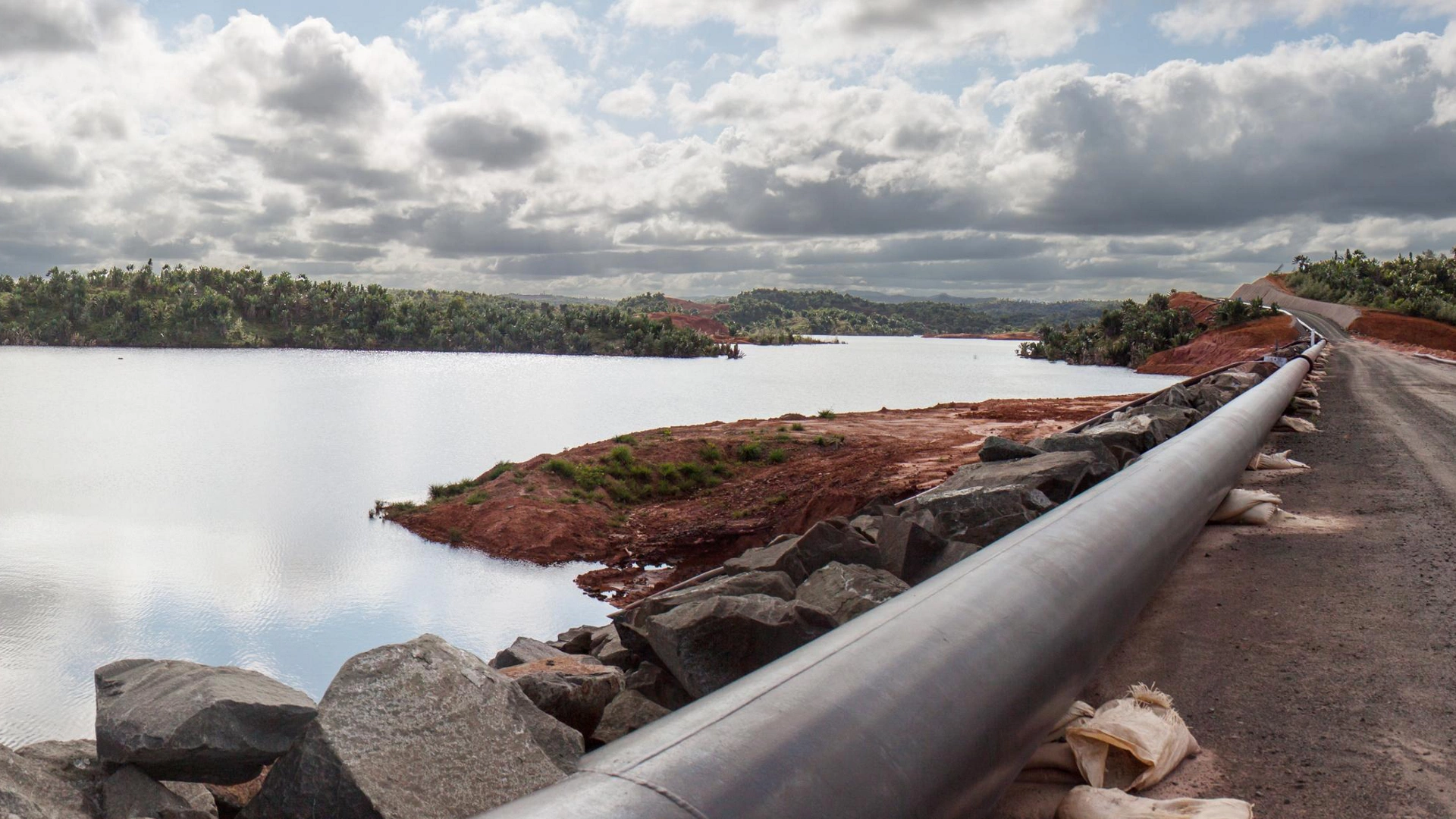 Mine tailings reservoir in Magadascar, receiving slurry through a pipeline from an ore processing plant 